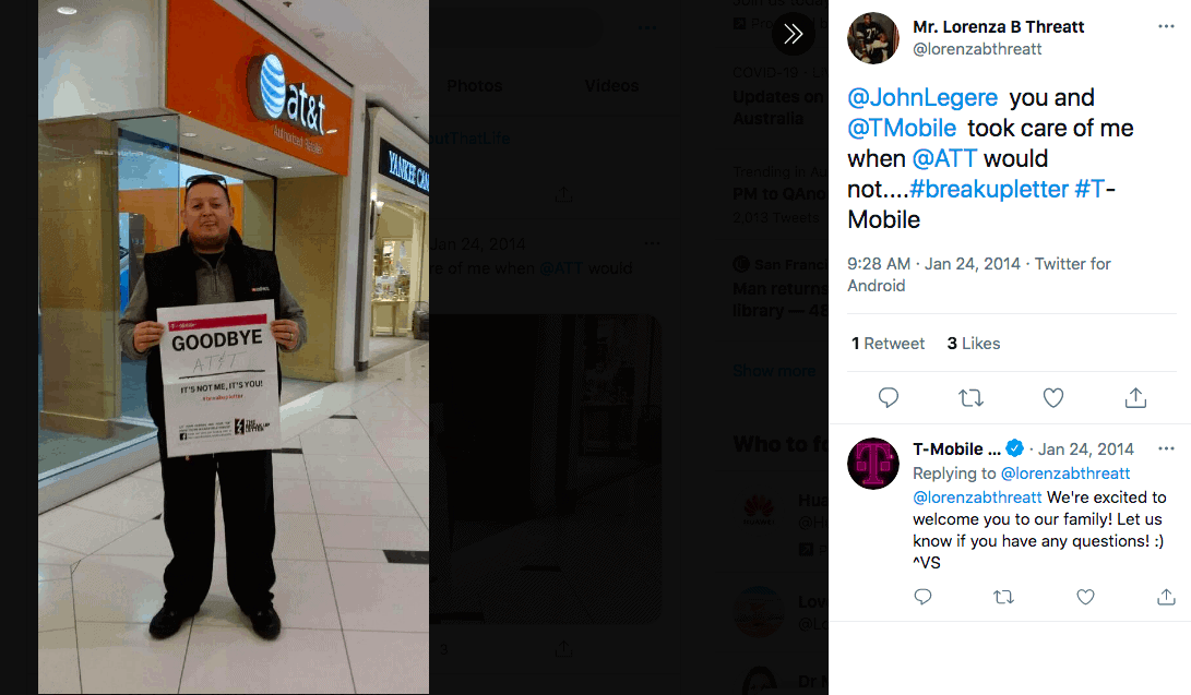 Instagram photo of man standing outside T-Mobile with a hand-written sign